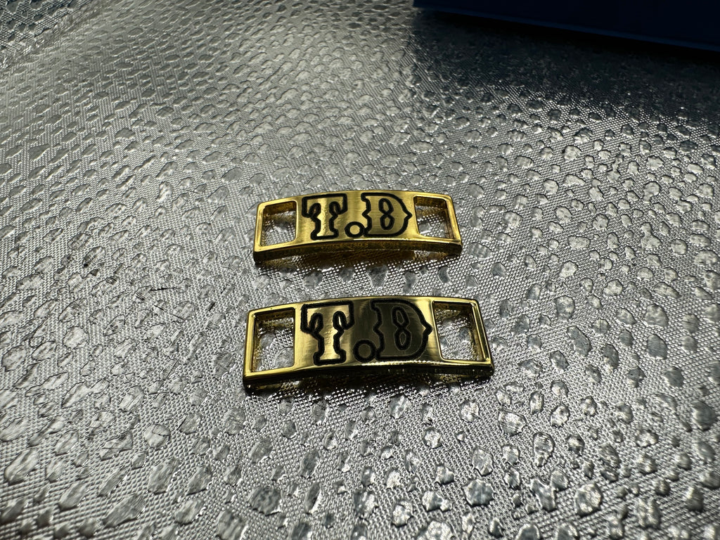 Lace up boot keeper plates